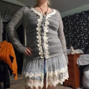 Laced sweater with attached mini skirt
